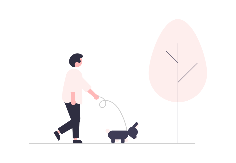 男性が犬の散歩をしている